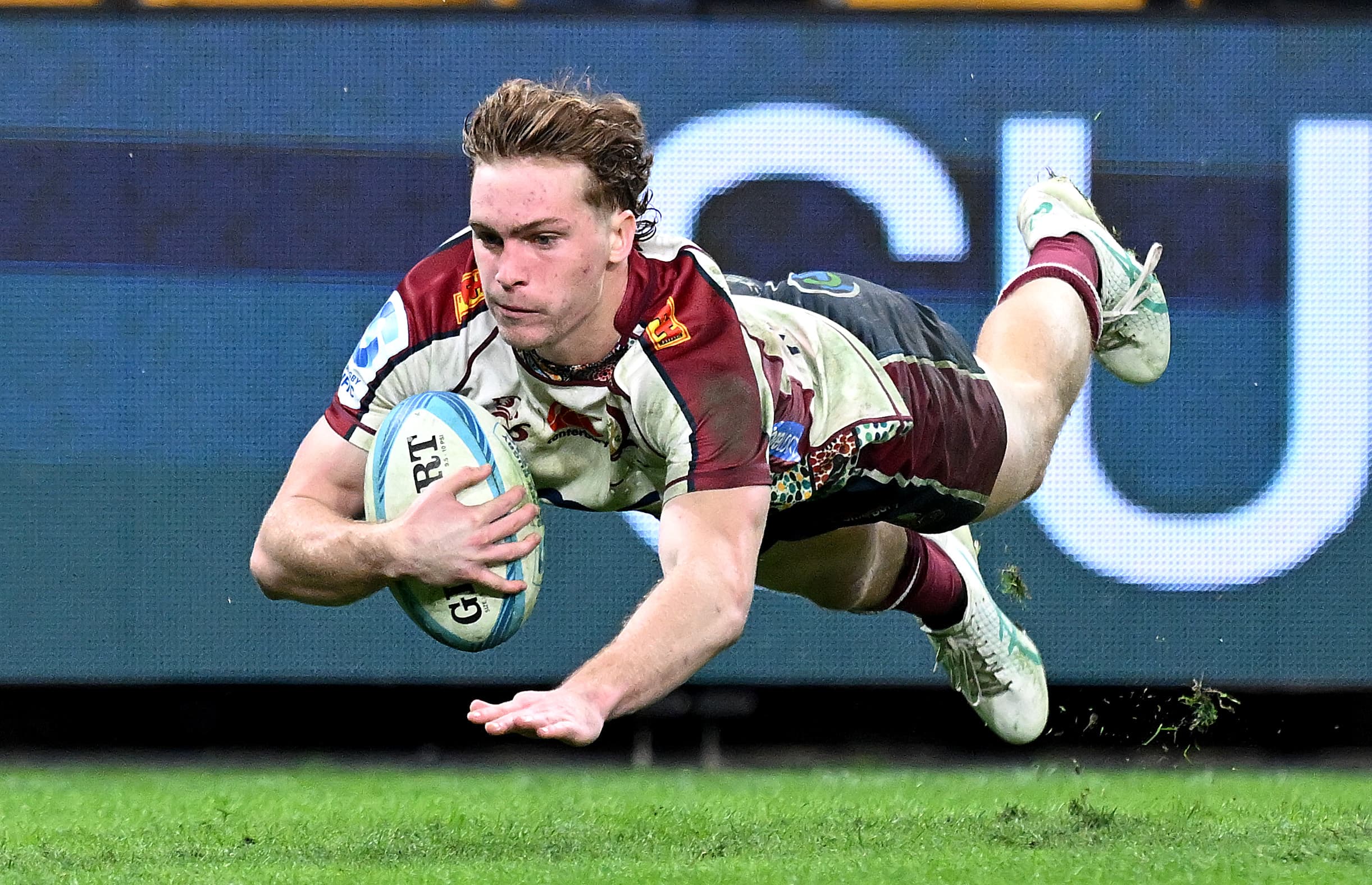 Tim Ryan dives over for a try during the Queensland Reds - Western Force Super Rugby Pacific clash at Suncorp Stadium. Picture: Getty