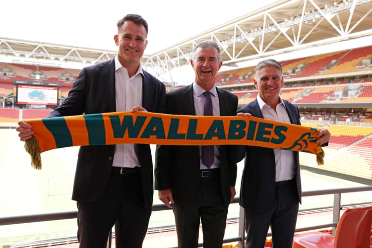 World Cup welcome for Brisbane...former Wallabies James Horwill (left) and Tim Horan flank Queensland Sports Minister Tim Mander