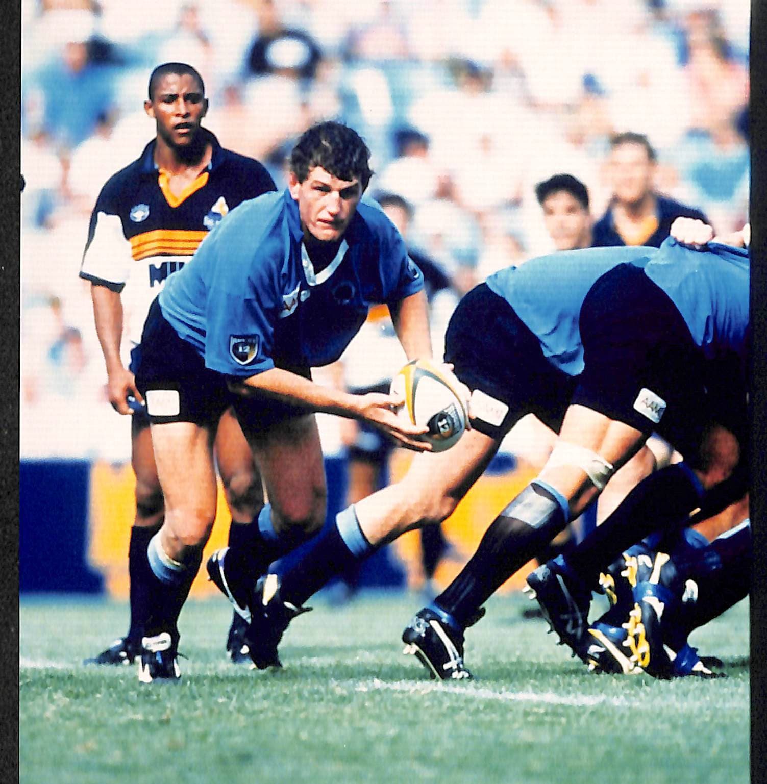 Action shot  New South Wales Waratah Tim Gavin clears ball from scrum with Gregan looking on v Brumbies