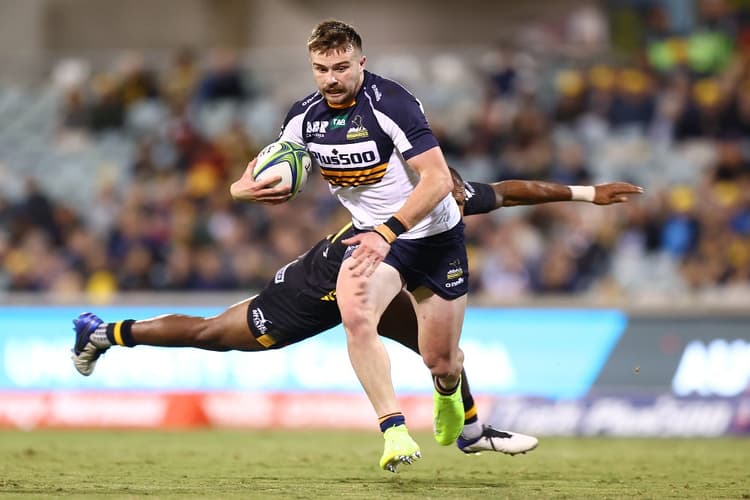 Former Brumbies teammates Tom Wright and James Slipper are proud of Mack Hansen's growth as a player as they prepare to face him on Sunday. Photo: Getty Images