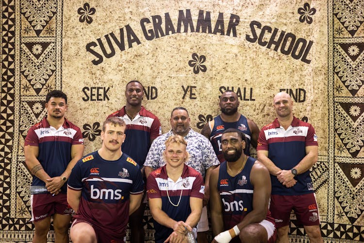 Niltech Consulting Chief Executive Nilesh Singh visited Suva Grammar with Reds (from left) Hunter Paisami, Cormac Daly, Suliasi Vunivalu, Louis Werchon, Peni Ravai and Seru Uru plus Sam Cordingley, QRU General Manager, Professional Rugby.