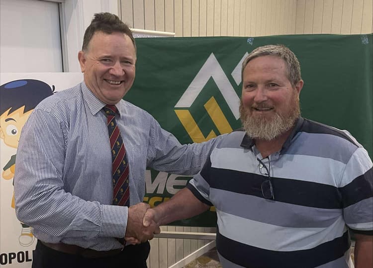 Darren Kayrooz (right) being congratulated earlier this year on his 20-year Service Award for Met West School Sport by John Brew