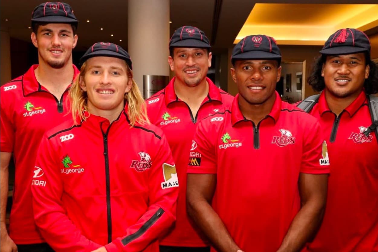 Queensland Reds co-captains Liam Wright and Tate McDermott (far left, second from left) after their 2019 Super Rugby debut. Picture: QRU Media Unit