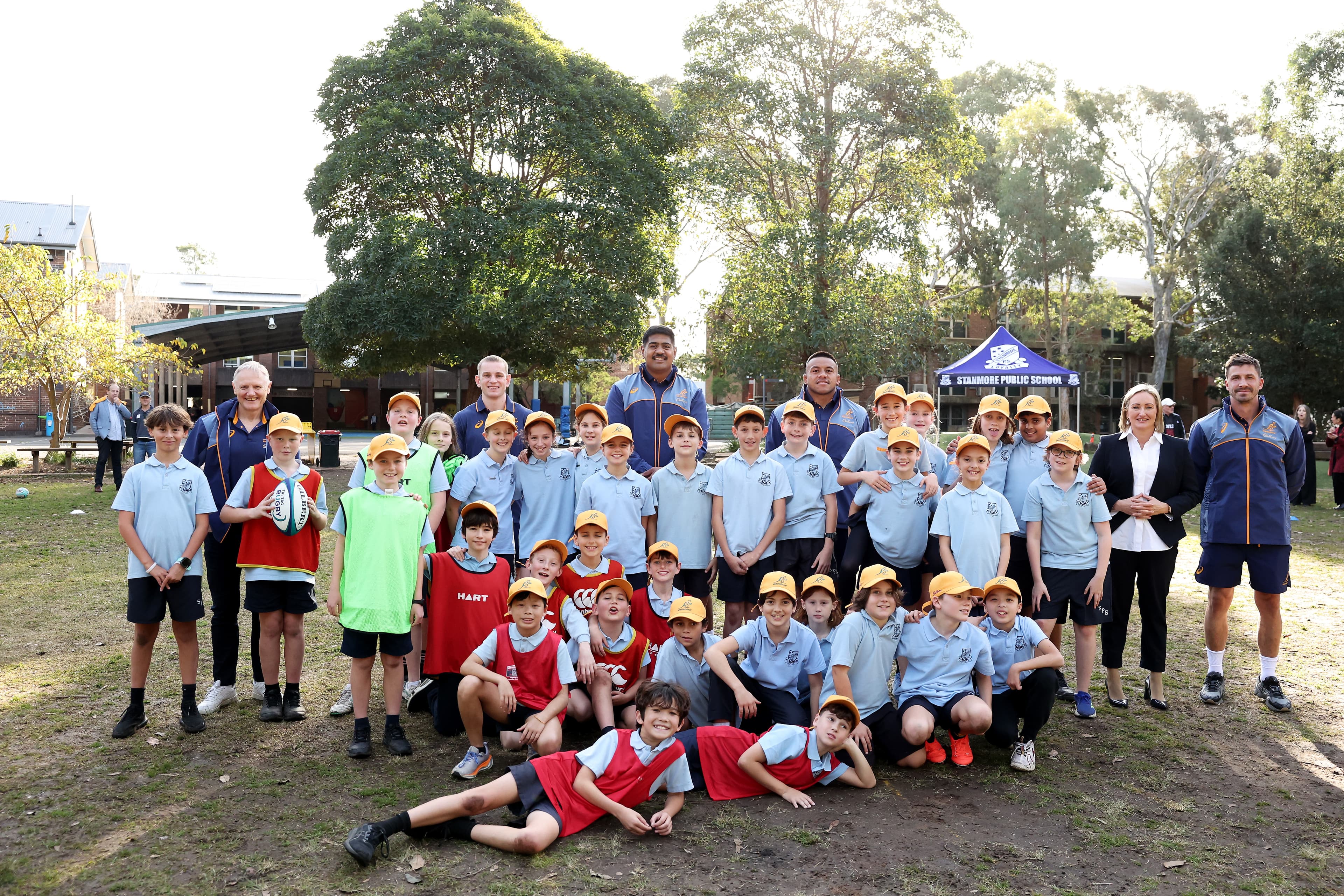Joe Schmidt and players Max Jorgensen, Will Skelton, Allan Alaalatoa and Jake Gordon at Stanmore Public School in Sydney's inner west. Photo: Getty Images