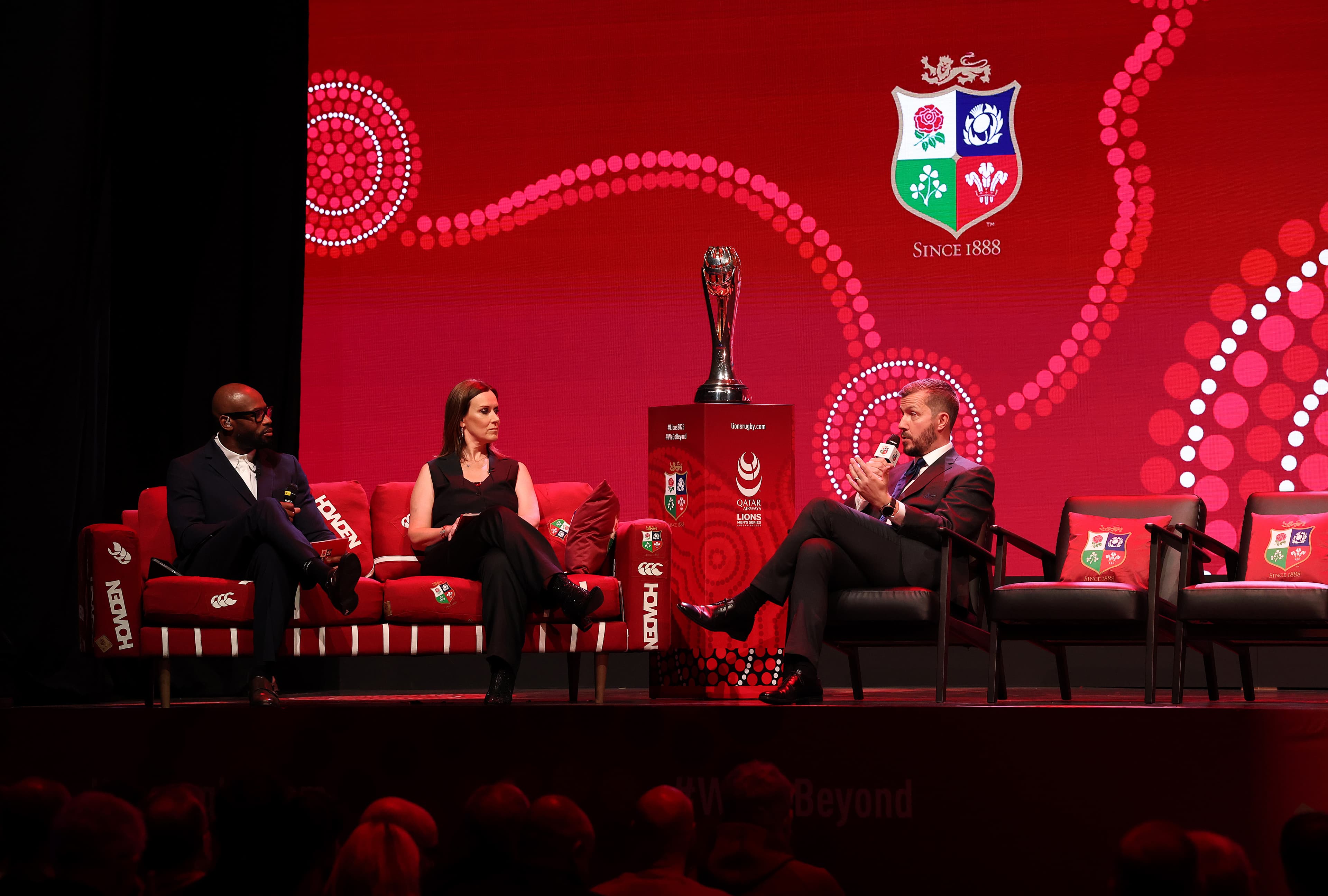 Ugo Monye and Lee McKenzie speak with Ben Calveley, Chief Executive Officer of The British & Irish Lions during British & Irish Lions squad and captain announcement. Photo: Getty Images