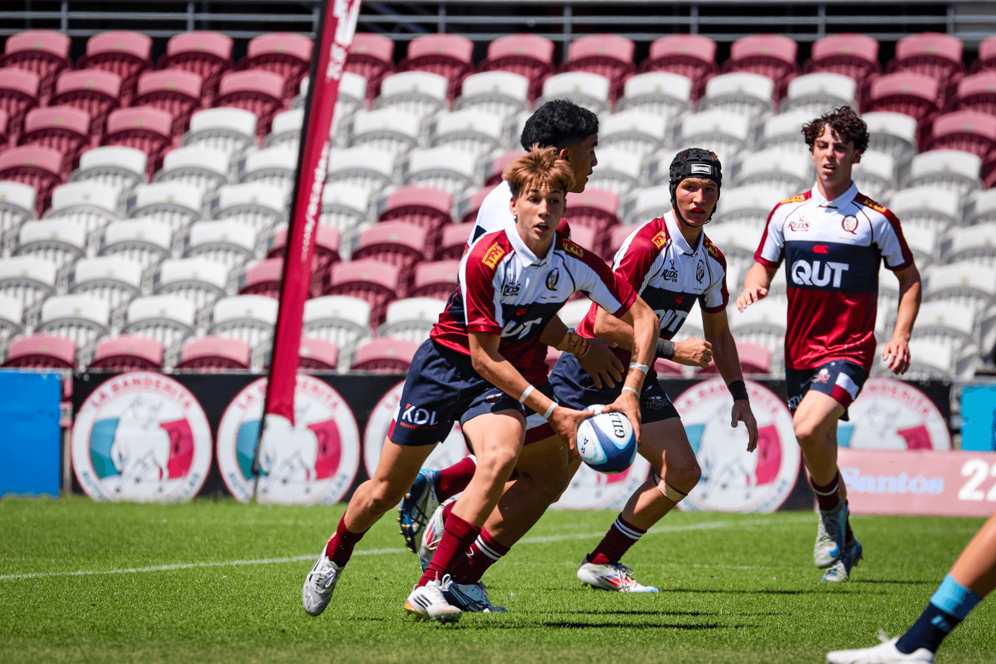Reds U15s flyhalf Levi Fien gets the backline rolling against the NSW Waratahs at Ballymore